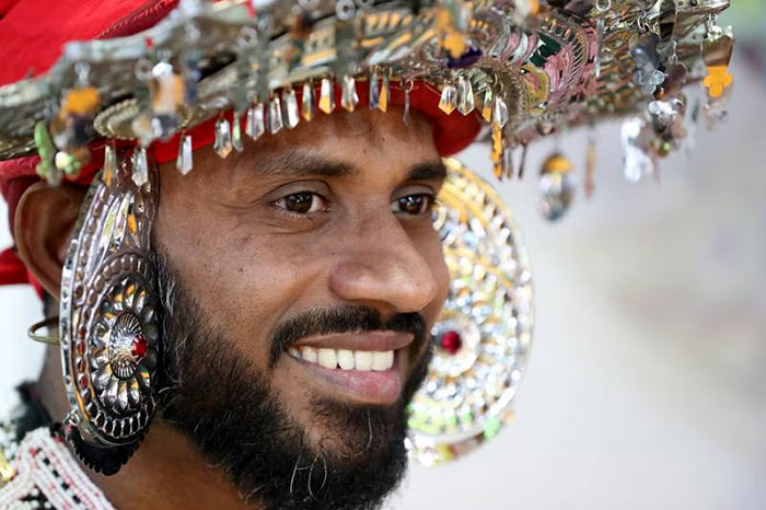 A man appears in traditional Sri Lankan dress at the Arabian travel market in Dubai