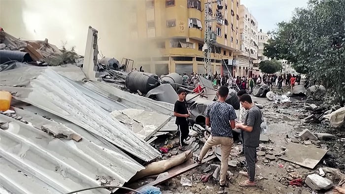 Palestinians inspect the destruction