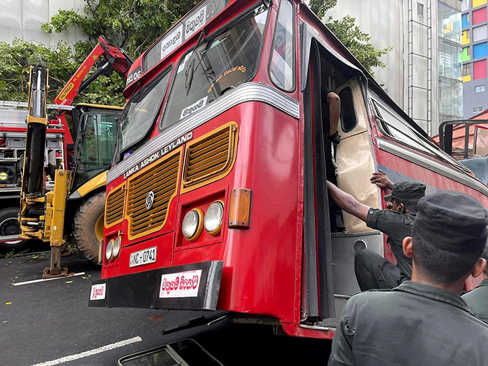 Tree falls on moving bus