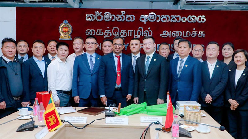 Chinese business delegation in a group photo with Minister Sunil Handunnetti during investment discussions in Sri Lanka - May 28, 2025