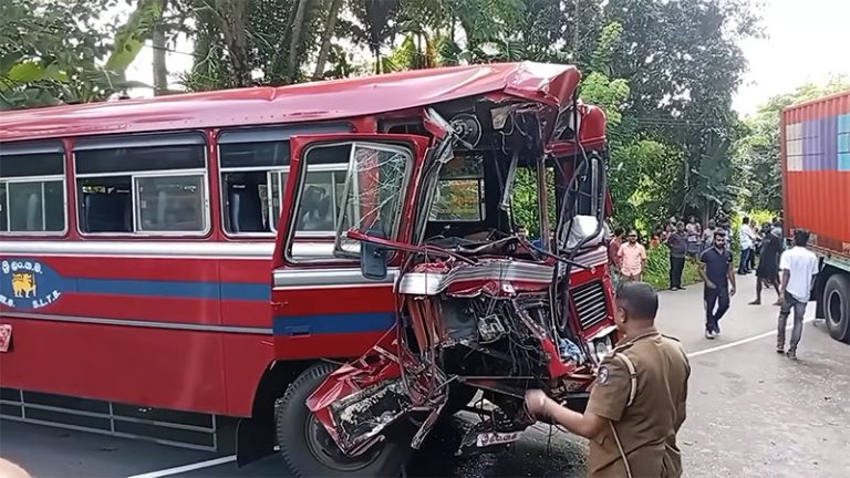 Damaged bus and truck after a collision in Meennana on the Ratnapura–Colombo main road