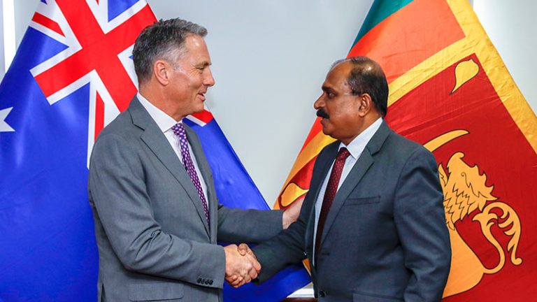 Australia's Deputy Prime Minister, Richard Marles and Sri Lanka's Deputy Minister of Defence, Aruna Jayasekara shake hands