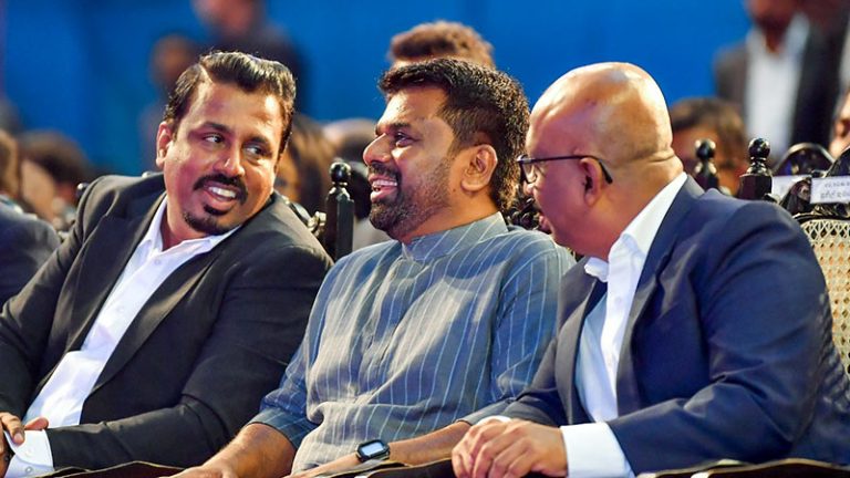 Sri Lanka President Anura Kumara Dissanayake with Minister Sunil Kumara Gamage and Deputy Minister Eranga Gunasekara chatting while watching the Youth Club National Convention