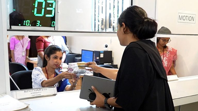 Female lawyer making a payment at a payment counter at the Supreme Court of Sri Lanka