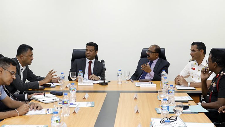 Health Minister Dr. Nalinda Jayatissa, Defence officials, and KDU leadership in a discussion at a meeting table during the hospital visit