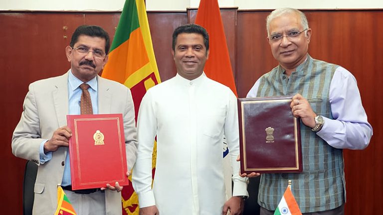 Health Minister Dr. Nalinda Jayatissa, Ministry Secretary Dr. Anil Jasinghe, and Indian High Commissioner Santosh Jha at the MoU signing in Colombo, Sri Lanka