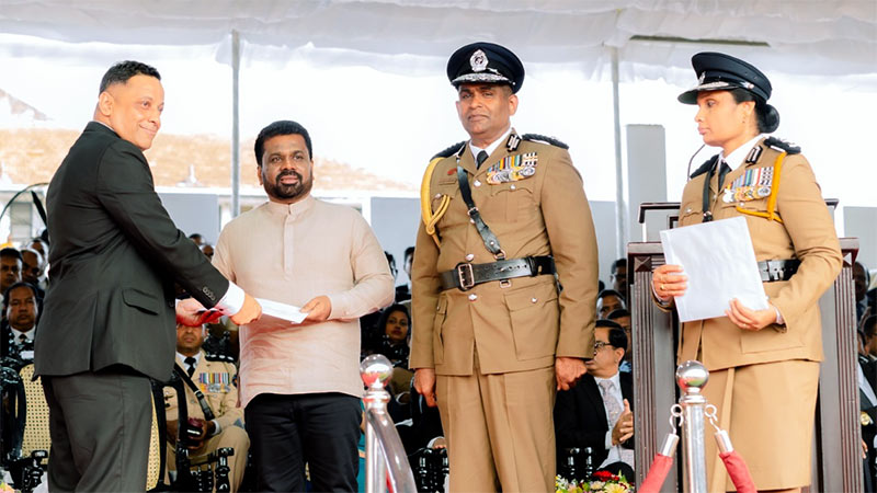 Sri Lanka President Anura Kumara Dissanayake awarding the Police Gallantry Medal to ASP Rohan Olugala during the 159th Police Day ceremony in Colombo