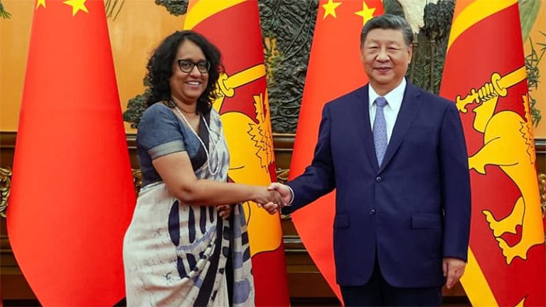 Sri Lanka Prime Minister Harini Amarasuriya and Chinese President Xi Jinping shaking hands in Beijing