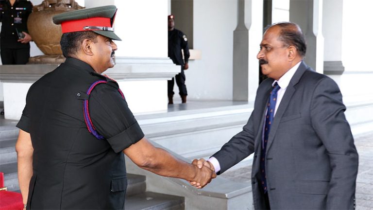 Lieutenant General Lasantha Rodrigo greets Deputy Defence Minister Aruna Jayasekara at Army Headquarters