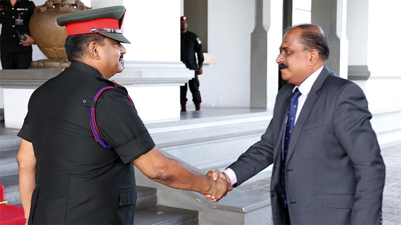 Lieutenant General Lasantha Rodrigo greets Deputy Defence Minister Aruna Jayasekara at Army Headquarters