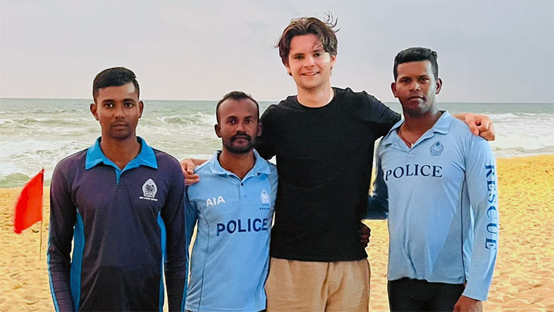 Sri Lanka Police pose with rescued Norwegian youth at Ahungalla beach