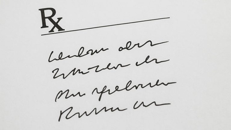 Unclear handwritten medical prescription on a white sheet, representing illegible doctor handwriting