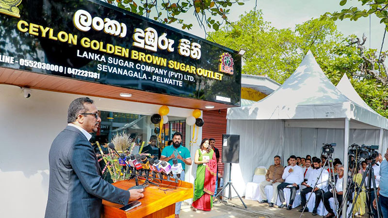 Minister Sunil Handunnetti addressing officials during the opening of Lanka Sugar Company’s brown sugar sales outlet in Nugegoda, Sri Lanka