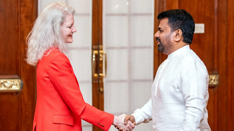 U.S. Under Secretary Allison Hooker shakes hands with Sri Lanka President Anura Kumara Dissanayake