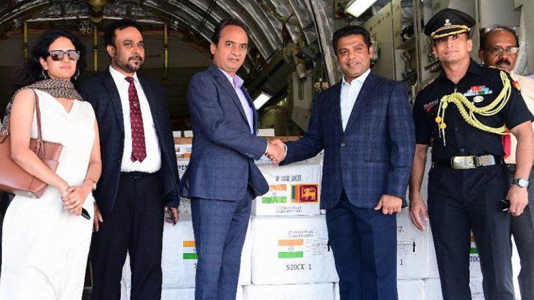 Deputy High Commissioner of India Dr. Satyanjal Pandey hands over a consignment of essential medicines and dry food items to Sri Lanka’s Minister of Health and Mass Media Dr. Nalinda Jayatissa at Bandaranaike International Airport in Katunayake