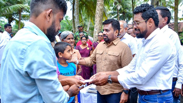 Sri Lanka President Anura Kumara Dissanayake speaks with villagers during area inspection
