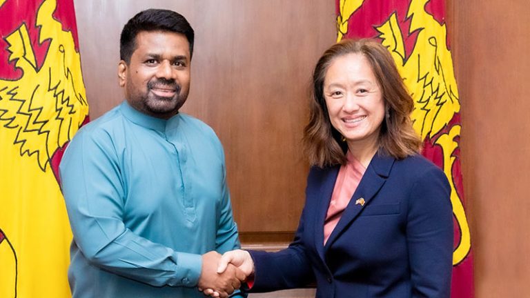Sri Lanka President Anura Kumara Dissanayake shaking hands with U.S. Ambassador Julie Chung
