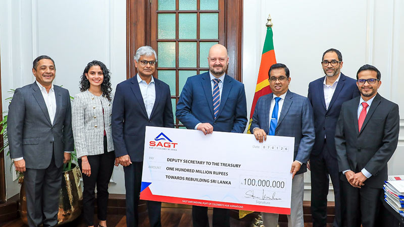 Steen Knudsen hands over donation cheque to Dr. Nandika Sanath Kumanayake, with John Keells Holdings and group company representatives present