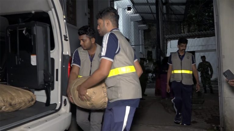 Officers of the Sri Lanka Police Narcotics Bureau loading seized narcotics into a van at the Colombo Magistrate’s Court