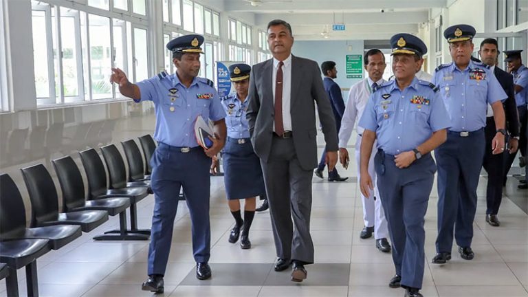 Defence Secretary Sampath Thuyacontha walks through Dr. Neville Fernando Teaching Hospital in Malabe with Sri Lanka Air Force officials during an inspection visit