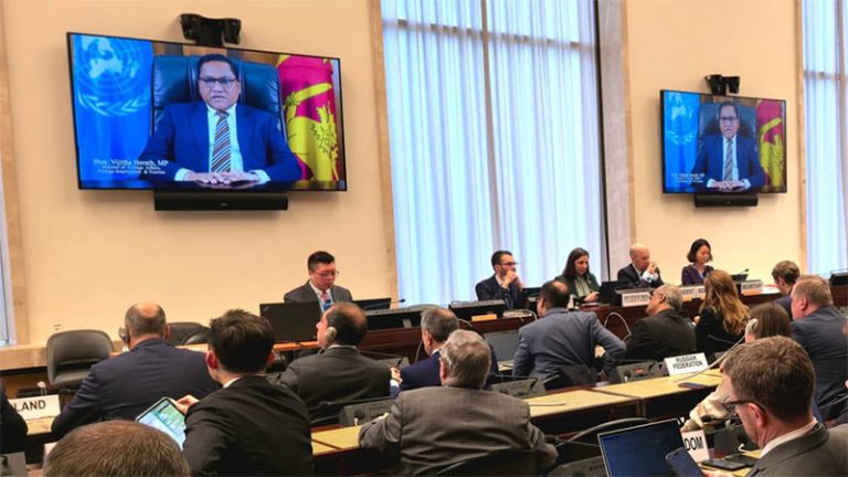 Minister Vijitha Herath addressing the Conference on Disarmament via video message as delegates in Geneva watch his speech on television screens during the high-level segment on February 23, 2026