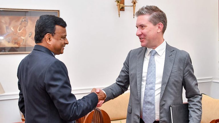 Anthony V. Pirnot shakes hands with Prabath Chandrakeerthi during talks at the Presidential Secretariat in Colombo