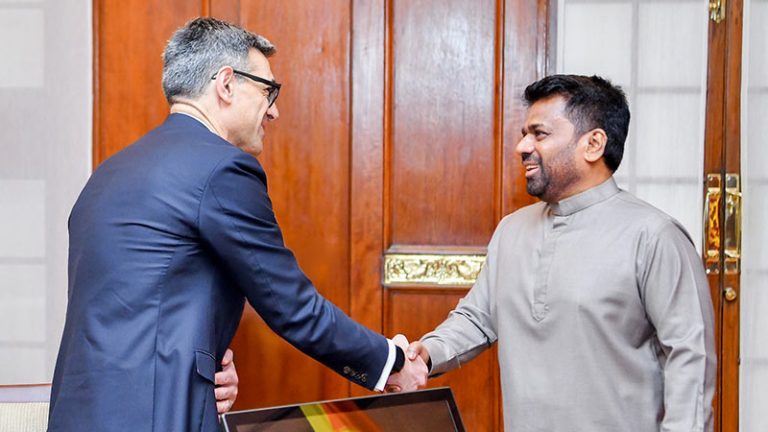 IMF Mission Chief Evan Papageorgiou shakes hands with Sri Lanka President Anura Kumara Dissanayake during talks at the Presidential Secretariat in Colombo