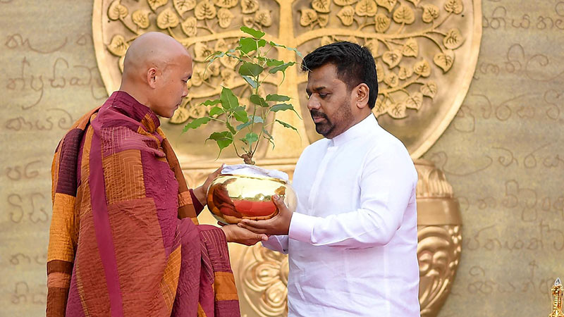Sri Lankan President Anura Kumara Dissanayake handing over Sacred Relics and a Sacred Jaya Sri Maha Bodhi sapling to Venerable Pannakara Thero at Independence Square in Colombo