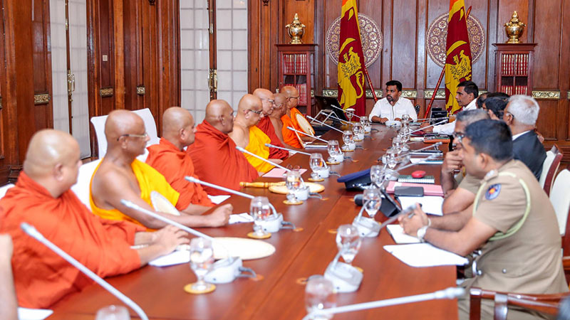 Sri Lankan President Anura Kumara Dissanayake attends a meeting with senior Buddhist monks and officials at the Presidential Secretariat in Colombo