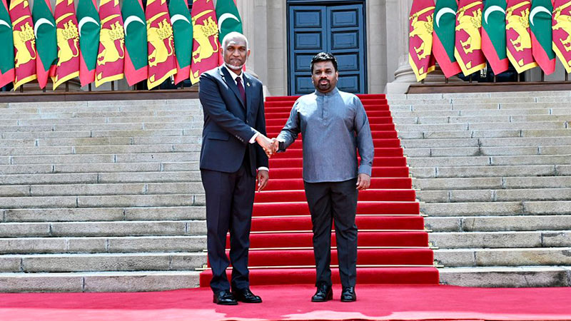 Sri Lankan President Anura Kumara Dissanayake and Maldivian President Dr. Mohamed Muizzu shake hands outside the Presidential Secretariat in Colombo