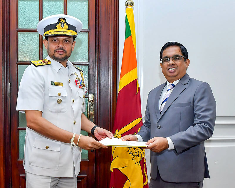 Vice Admiral Damian Fernando receiving his appointment letter as Sri Lanka Navy Commander from Secretary to the President Dr. Nandika Sanath Kumanayake
