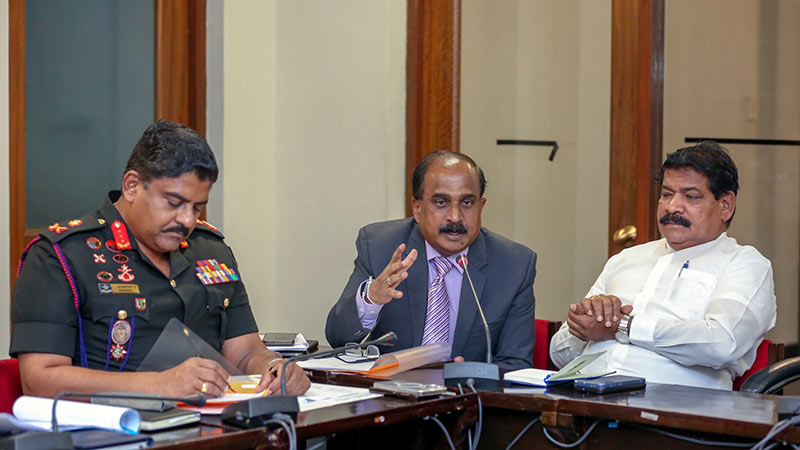 Sri Lanka Deputy Defence Minister Aruna Jayasekara speaks at the Jaffna land progress review meeting as Minister Ramalingam Chandrasekar and Army Commander Lt. Gen. Lasantha Rodrigo listen