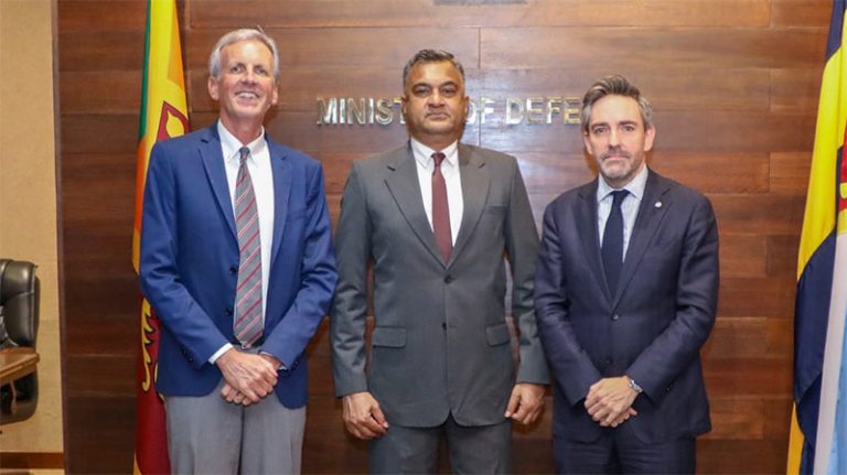 UN Resident Coordinator Marc-André Franche, WFP Country Director Philip Ward, and Defence Secretary Sampath Thuyacontha pose for a group photograph