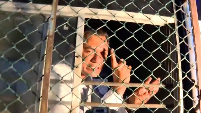 Sugeeshwara Bandara inside a prison bus after being remanded until July 1, 2026