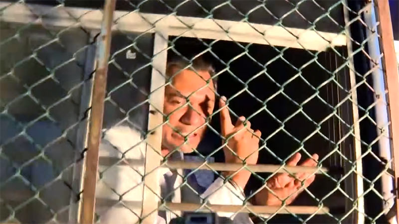 Sugeeshwara Bandara inside a prison bus after being remanded until July 1, 2026