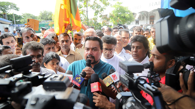 Former MP Wimal Weerawansa speaks to the media during a Satyagraha campaign near Fort Railway Station on June 8, 2026, over the detention of former intelligence chief Suresh Sallay