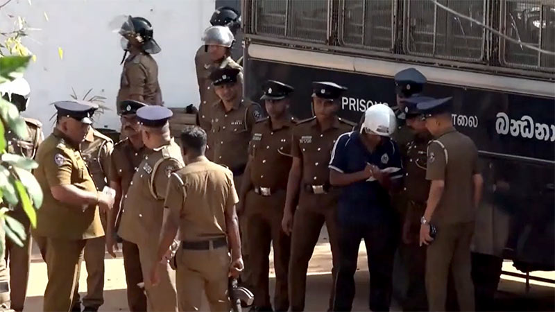 Police officers outside Negombo Prison following inmate clash