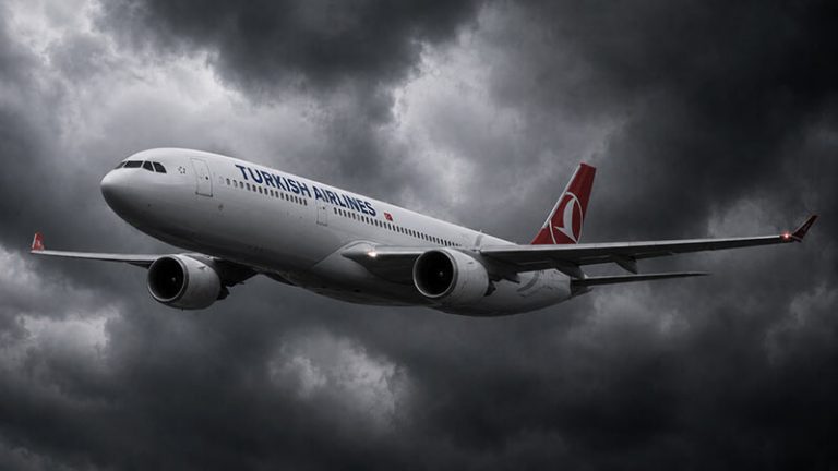 Turkish Airlines plane flying through dark storm clouds