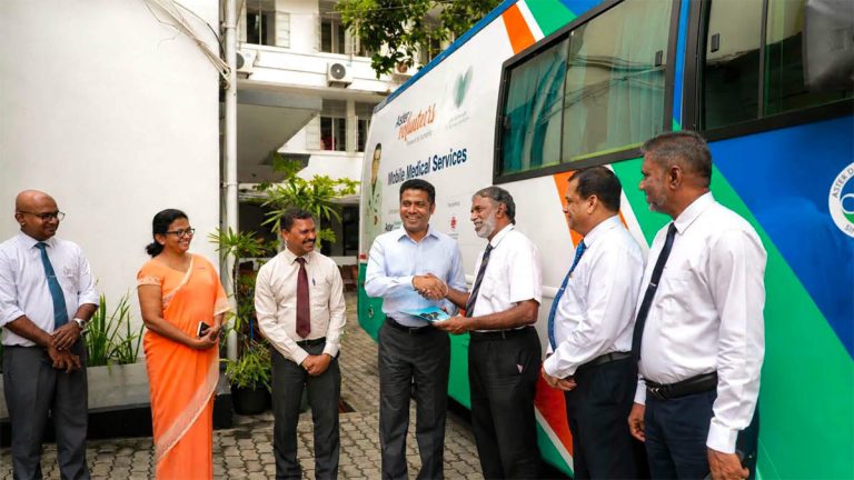 Minister Nalinda Jayatissa hands over mobile drug testing bus to the National Transport Medical Institute in Sri Lanka