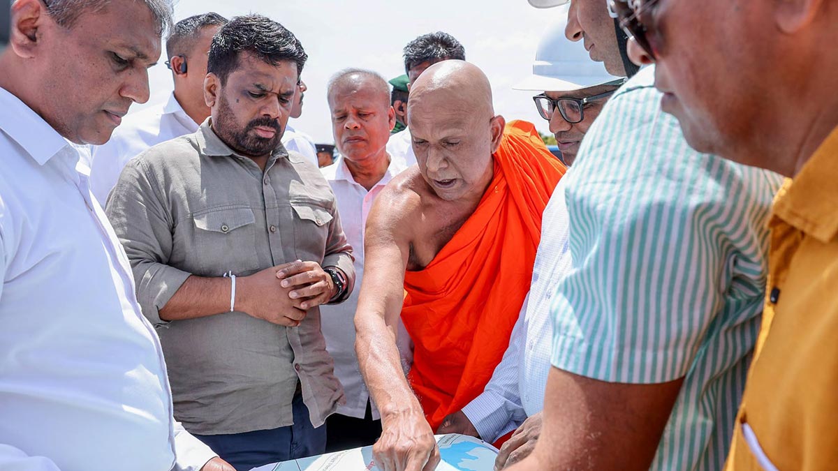President Anura Kumara Dissanayake inspects a project map during a visit to the Lower Malwathu Oya Multi-Purpose Development Project