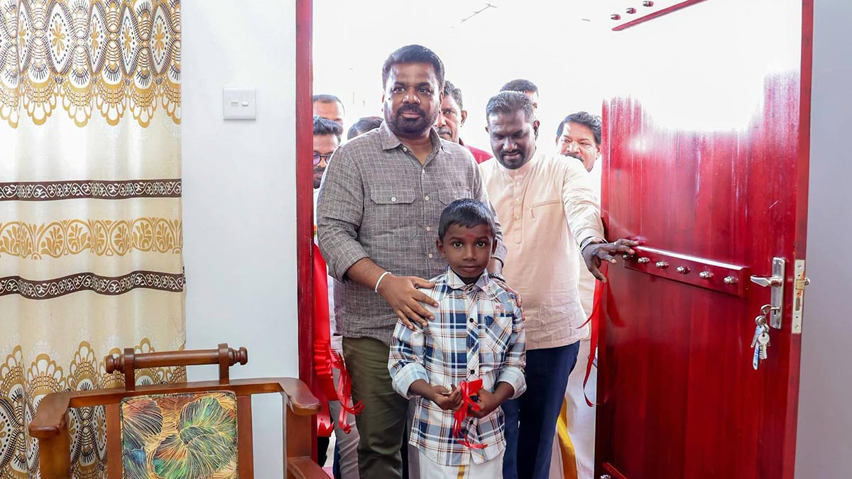 President Anura Kumara Dissanayake enters a newly built house at the Navodayagama housing project in Poonagala, Sri Lanka