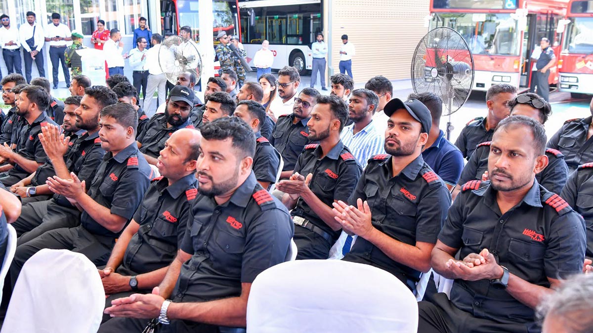 Metro Bus workers seated in the audience at the Metro Bus launch event in Sri Lanka