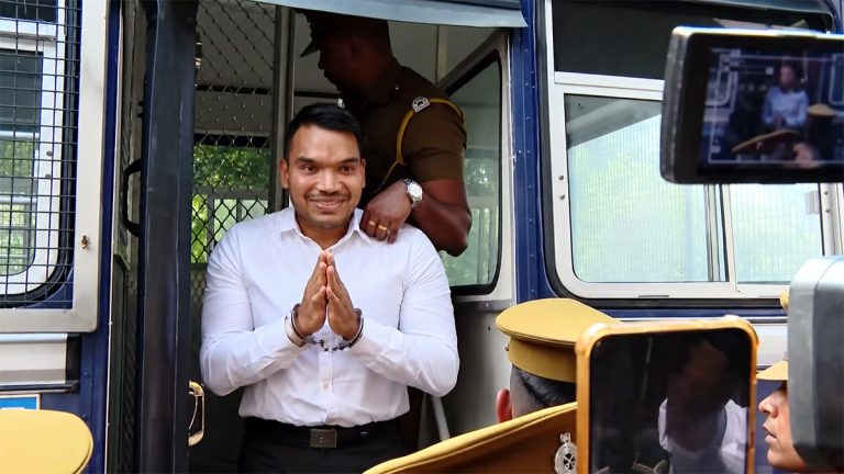 Namal Rajapaksa arriving at court from a prison bus in handcuffs on September 18, 2026