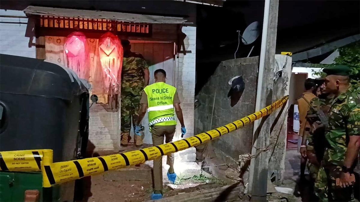 Police officers at the house targeted in the Dehiwala grenade attack