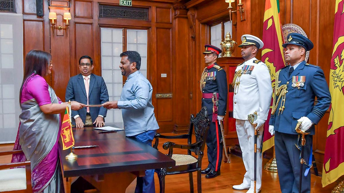 Sajeewani Dilka Lakmali Karunannayake receiving her appointment document from President Anura Kumara Dissanayake after being sworn in as a Court of Appeal Judge