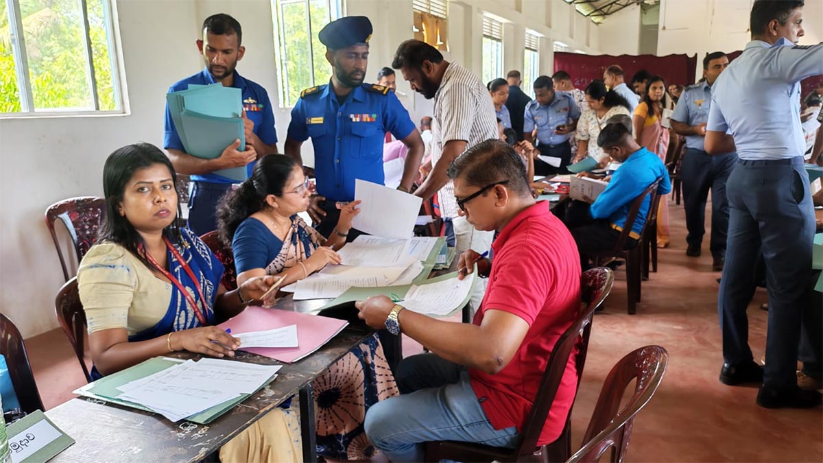 Sri Lankan armed forces personnel participating in the land ownership documentation process at Diyabeduma Parakumgama Ranaviru Village in Polonnaruwa