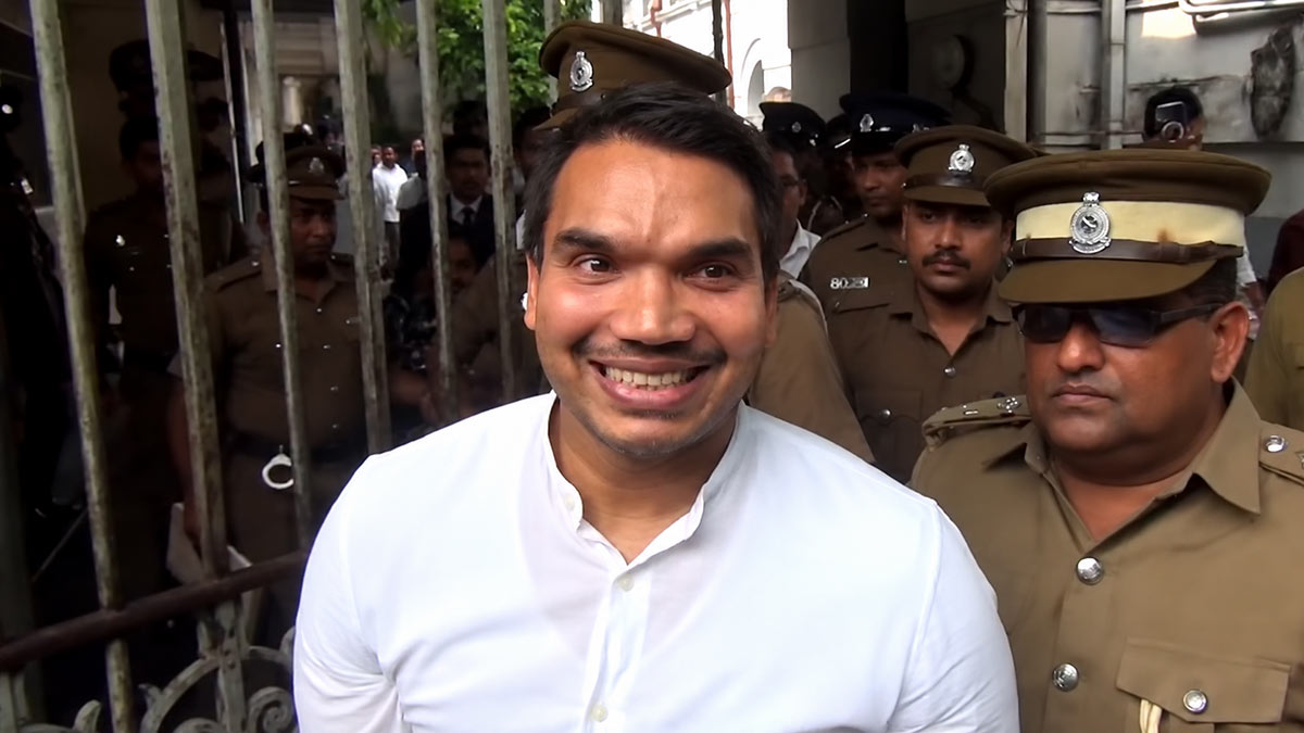 Namal Rajapaksa returning to a prison bus after appearing before the Colombo Chief Magistrate's Court