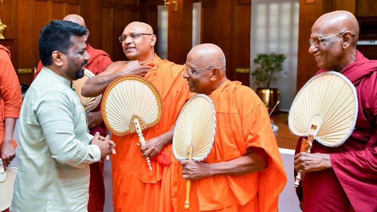 Sri Lanka President Anura Kumara Dissanayake standing and speaking with members of the Maha Sangha at the Presidential Secretariat in Colombo