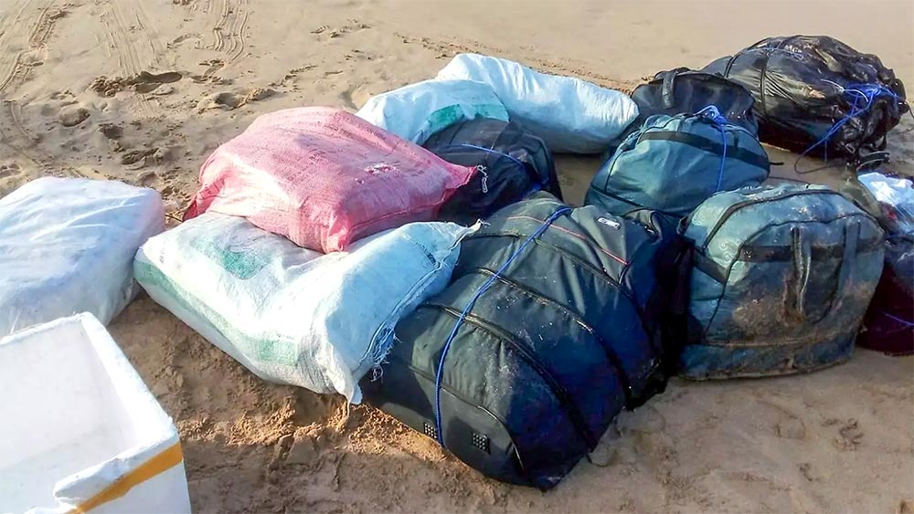Sacks and travel bags containing over 457kg of Ice and heroin seized during a joint Navy-Coast Guard operation in Matara