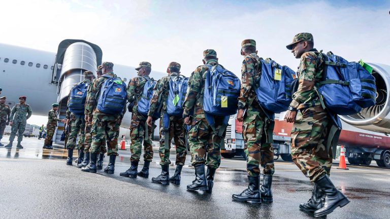 Sri Lanka Army personnel queue to board a plane for the Gang Suppression Force mission in Haiti